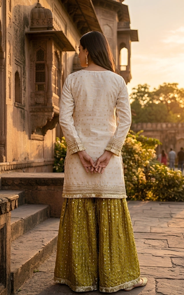 CENE white cotton jacqurd with copper zari paired with flared pants
